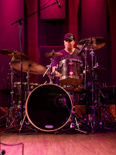 Tyler Ingersoll playing drums on stage